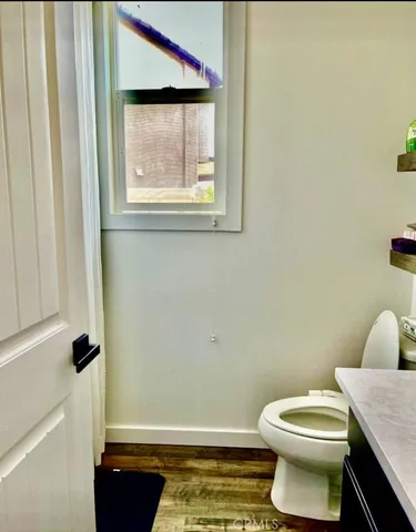 a bedroom with bed and window