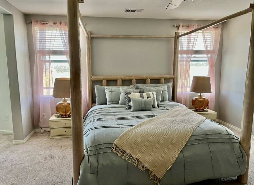 31509 Tuberose Road Murrieta, CA 92563 - Photo 29 of 41 a bedroom with a bed and wooden floor