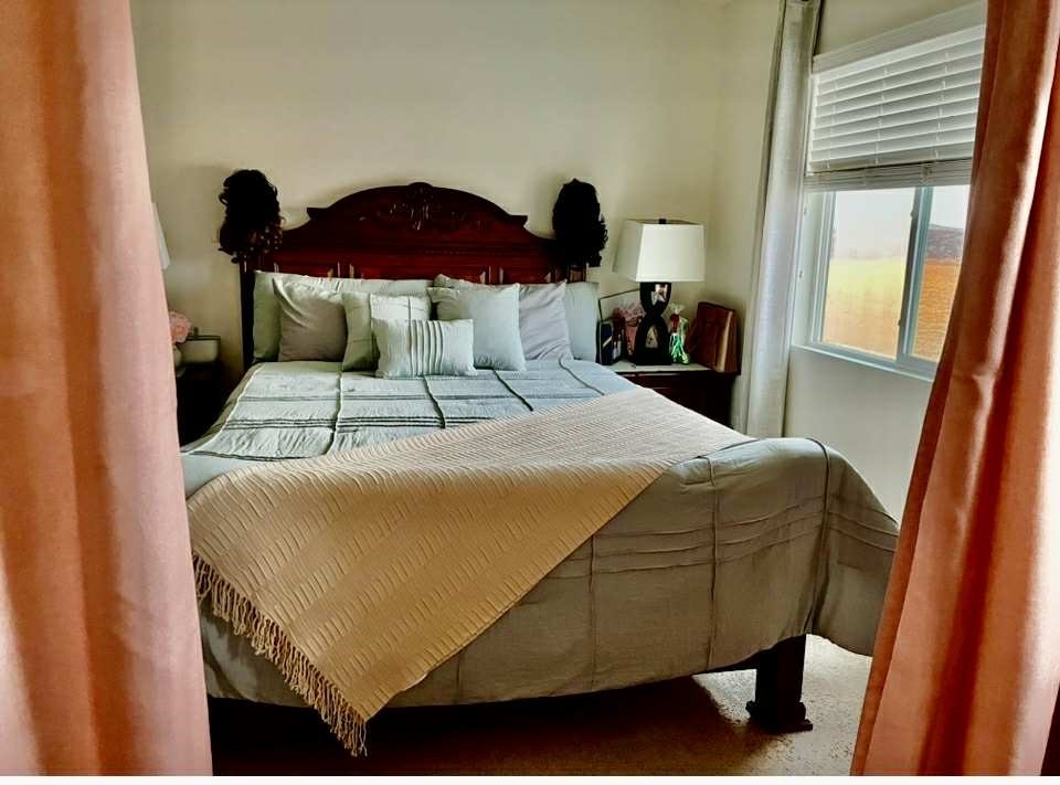 31509 Tuberose Road Murrieta, CA 92563 - Photo 32 of 41 a bedroom with a bed and a large window