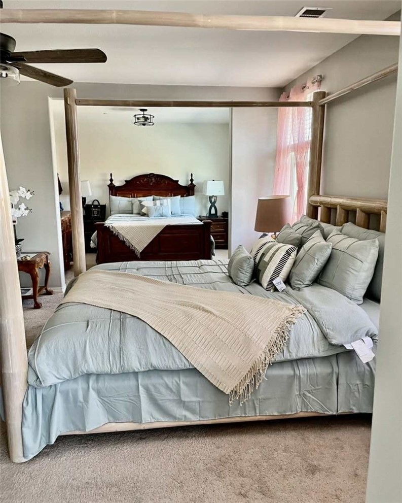 31509 Tuberose Road Murrieta, CA 92563 - Photo 33 of 41 a bedroom with a bed and a mirror