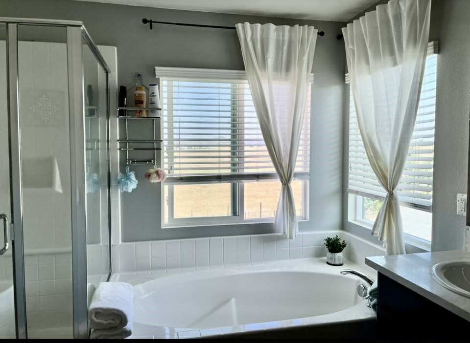 31509 Tuberose Road Murrieta, CA 92563 - Photo 35 of 41 a bath tub sitting in a bathroom next to a window