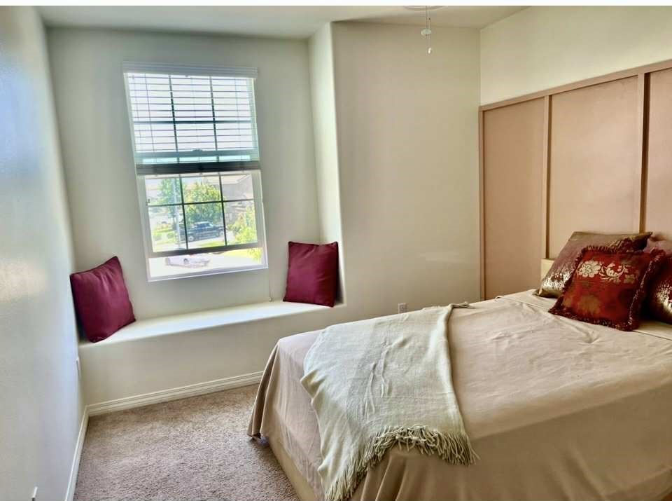 31509 Tuberose Road Murrieta, CA 92563 - Photo 37 of 41 a bedroom with a bed and window