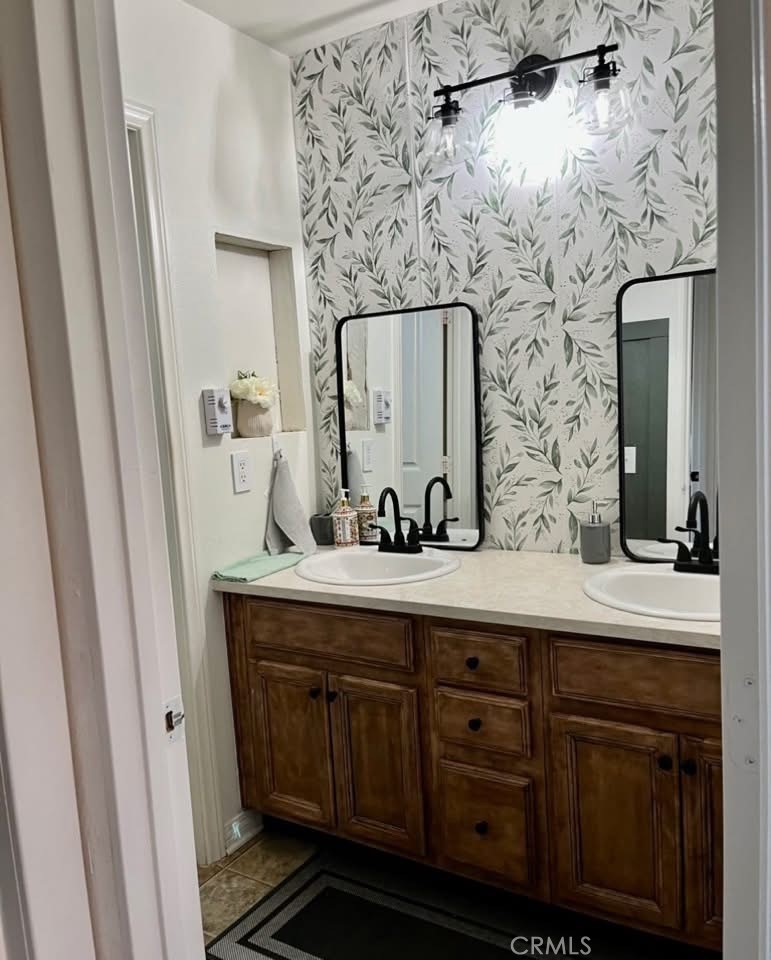 31509 Tuberose Road Murrieta, CA 92563 - Photo 40 of 41 a bathroom with a sink and a mirror