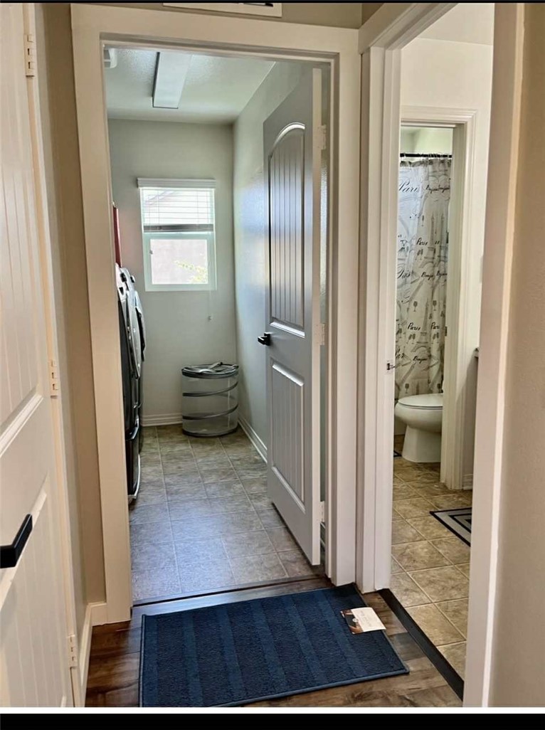 31509 Tuberose Road Murrieta, CA 92563 - Photo 41 of 41 a view of a hallway with wooden floor and a living room