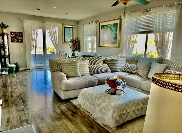 a living room with furniture and a large window