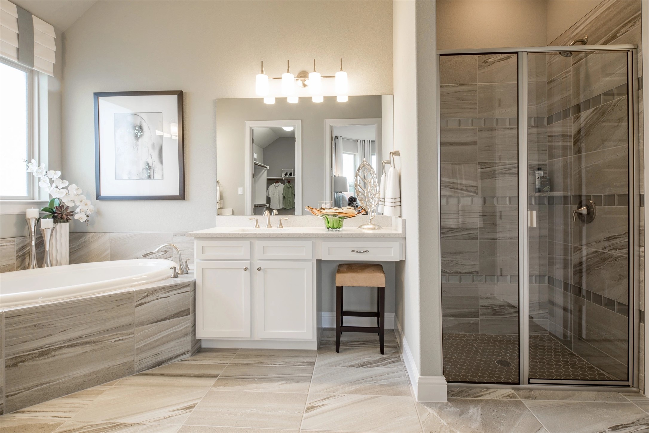 1229 Terrace View Drive Georgetown, TX 78628 - Photo 7 of 17 A well-appointed primary bathroom showcases a deep soaking tub and a spacious, glass-enclosed shower.