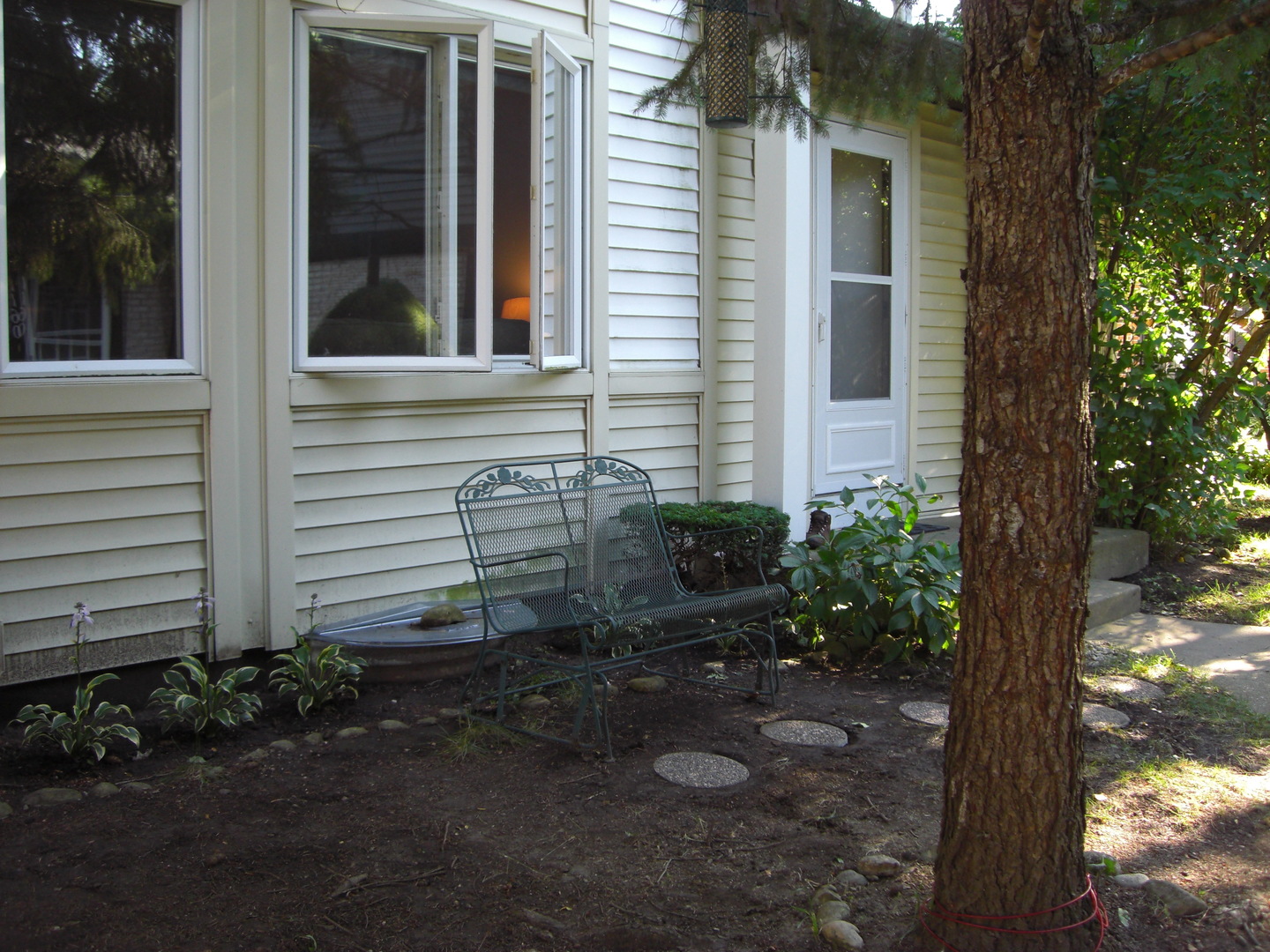 1154 Inverrary Lane, Unit 1154 Deerfield, IL 60015 - Photo 1 of 19 a view of a house with backyard and garden