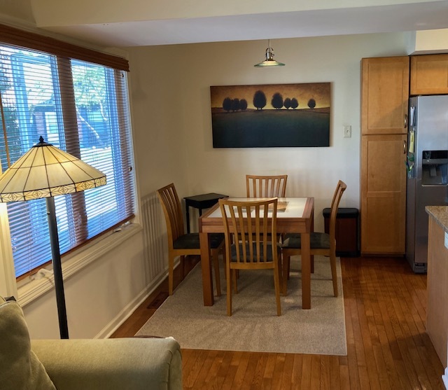 1154 Inverrary Lane, Unit 1154 Deerfield, IL 60015 - Photo 11 of 19 a view of a dining room with furniture and chandelier