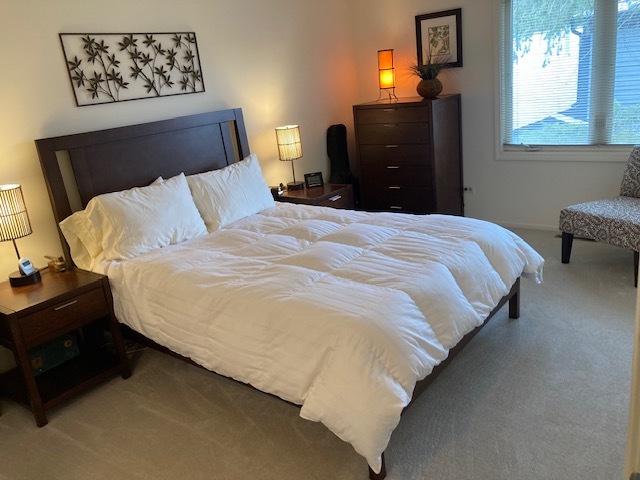1154 Inverrary Lane, Unit 1154 Deerfield, IL 60015 - Photo 12 of 19 a bedroom with a bed and window