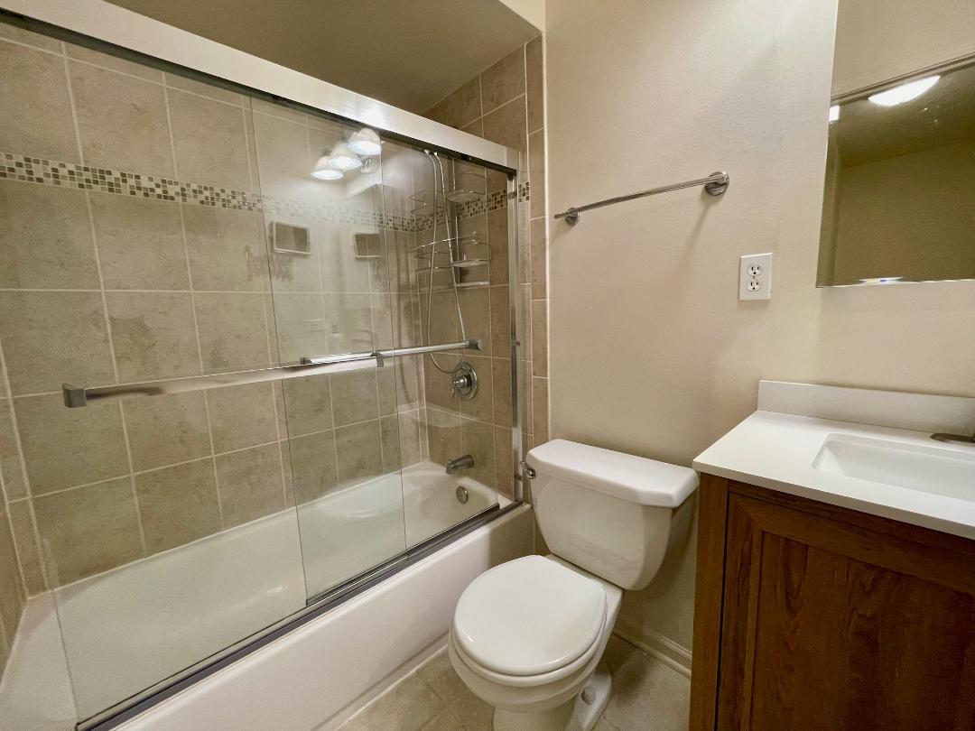 1154 Inverrary Lane, Unit 1154 Deerfield, IL 60015 - Photo 14 of 19 a white toilet sitting next to a bath tub