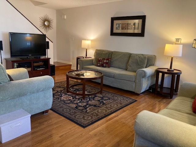 1154 Inverrary Lane, Unit 1154 Deerfield, IL 60015 - Photo 2 of 19 a living room with furniture and a flat screen tv