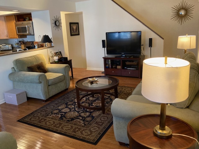 1154 Inverrary Lane, Unit 1154 Deerfield, IL 60015 - Photo 3 of 19 a living room with furniture and a flat screen tv