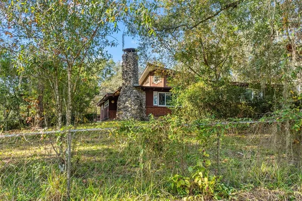 a bathroom with a sink vanity mirror and toilet