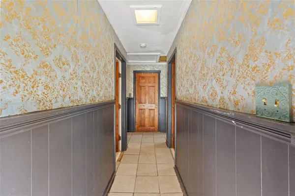 a bathroom with a granite countertop sink a toilet and shower
