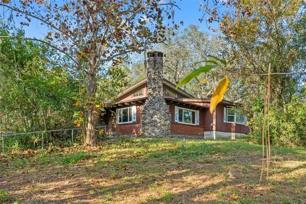 a view of a field with an ocean view
