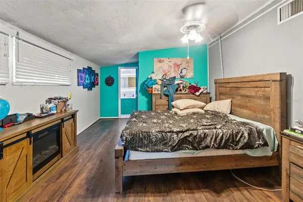 a view of a house with yard and sitting area