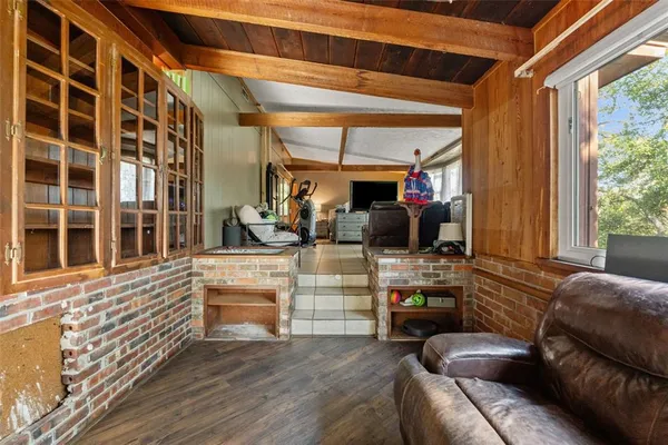 a view of a patio with table and chairs and potted plants