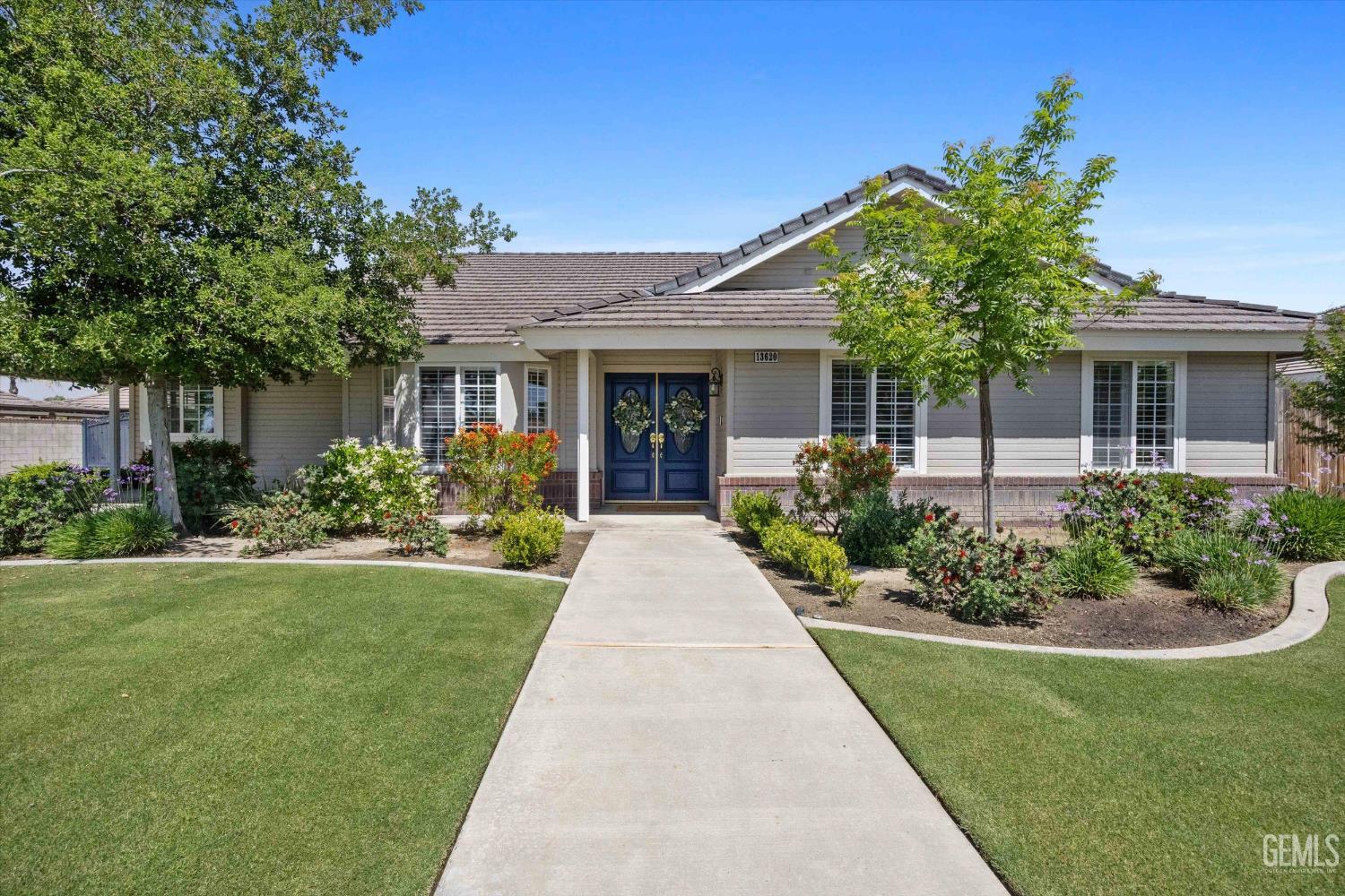 Undisclosed Address Bakersfield, CA 93314 - Photo 1 of 58 a front view of a house with a yard