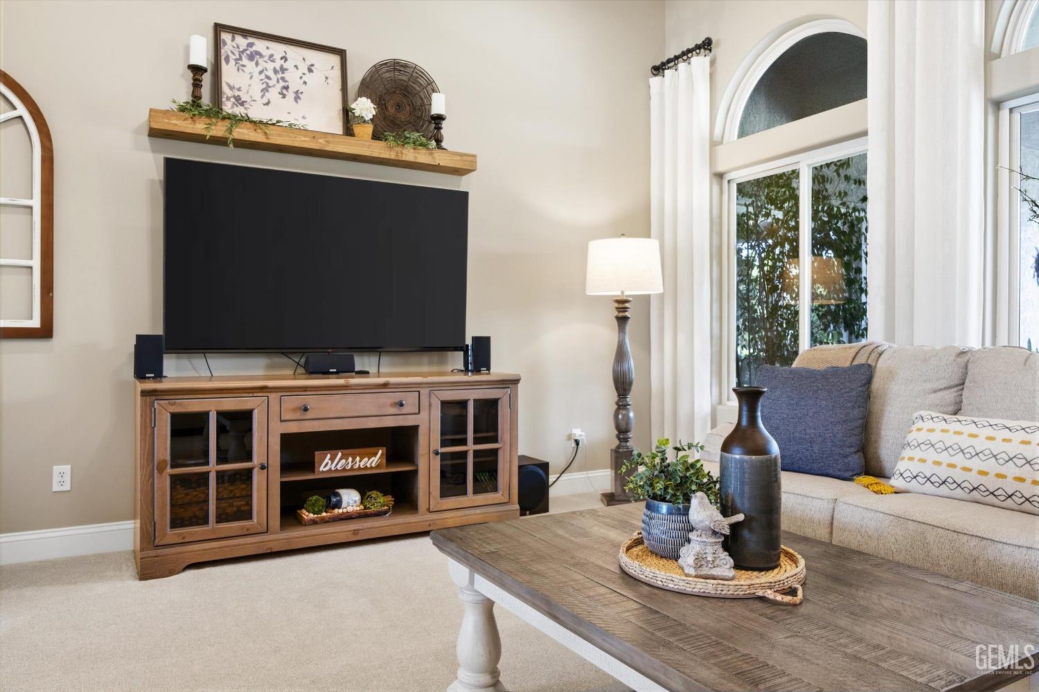 Undisclosed Address Bakersfield, CA 93314 - Photo 11 of 58 a living room with furniture and a flat screen tv