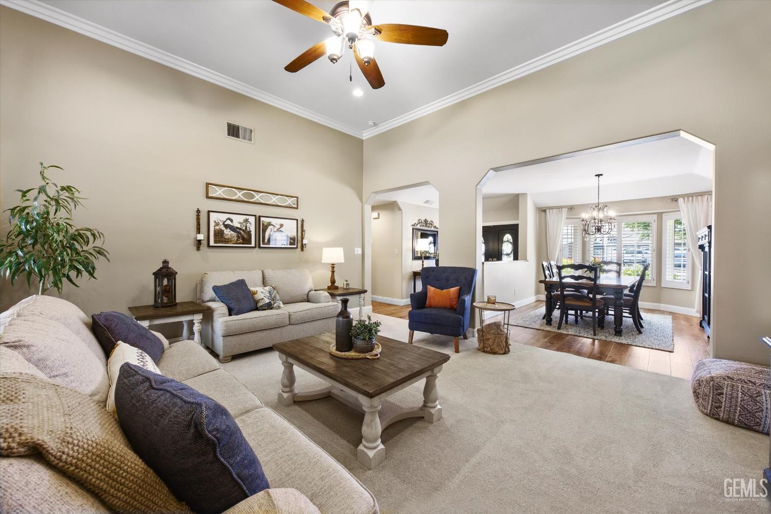 Undisclosed Address Bakersfield, CA 93314 - Photo 12 of 58 a living room with furniture and wooden floor