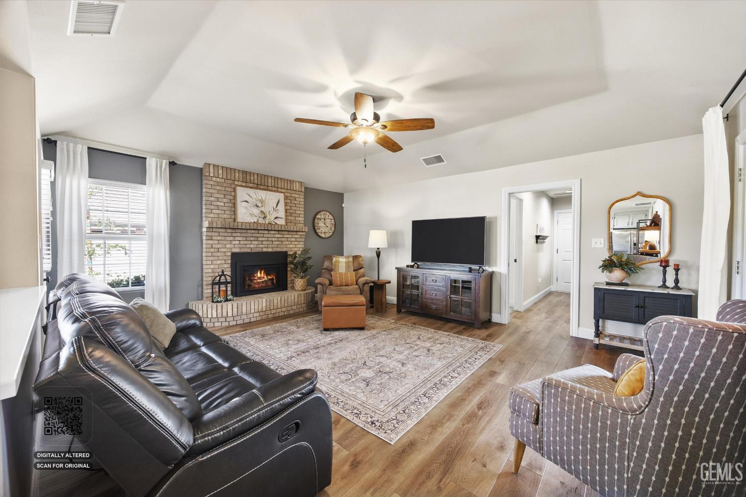Undisclosed Address Bakersfield, CA 93314 - Photo 14 of 58 a living room with furniture a flat screen tv and a fireplace