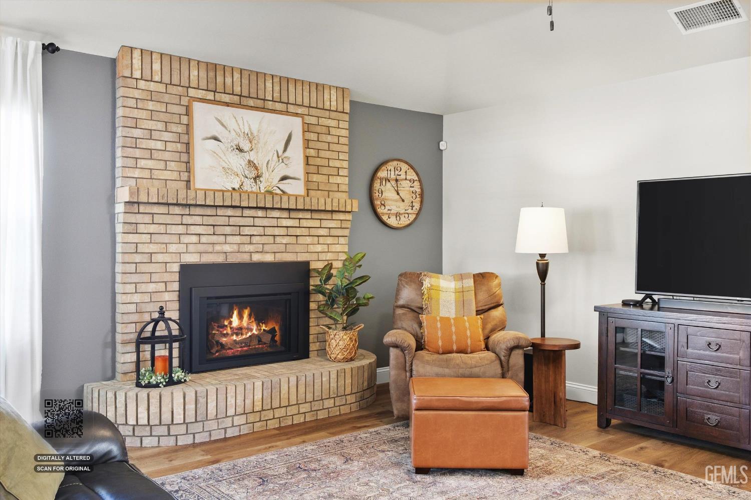 Undisclosed Address Bakersfield, CA 93314 - Photo 15 of 58 a living room with furniture a flat screen tv and a fireplace