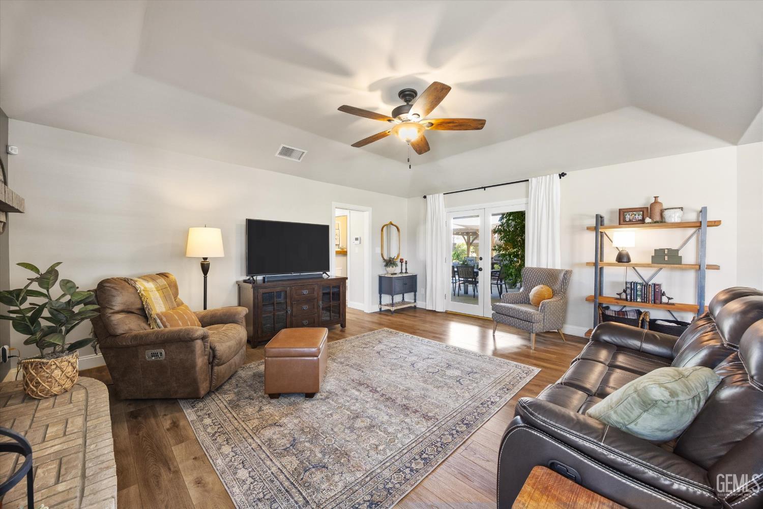 Undisclosed Address Bakersfield, CA 93314 - Photo 16 of 58 a living room with furniture and a flat screen tv
