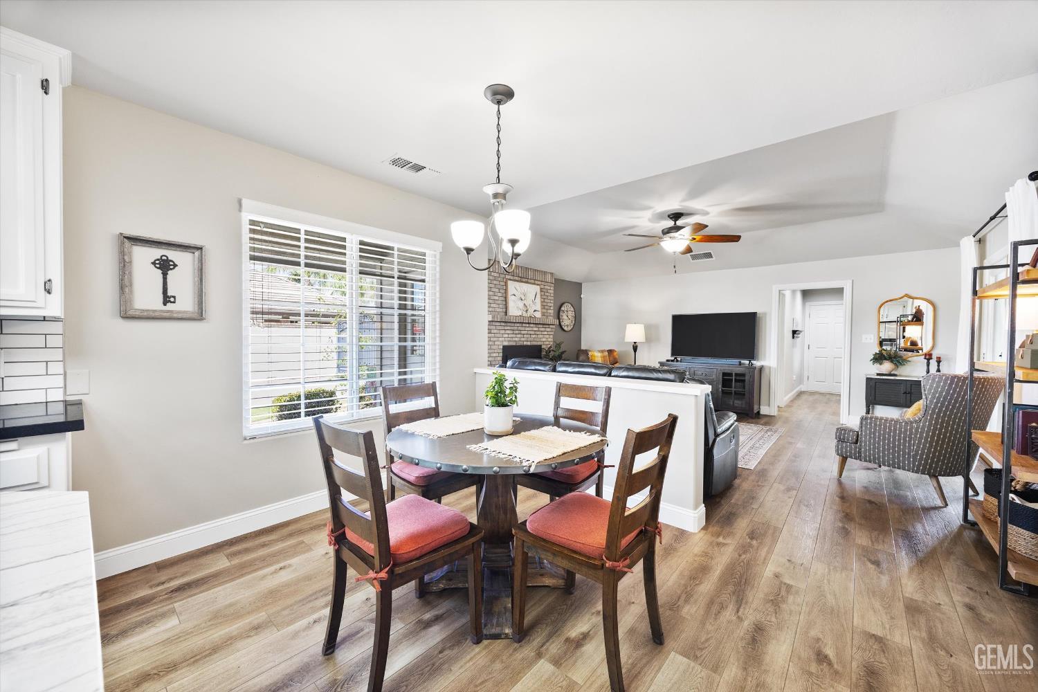 Undisclosed Address Bakersfield, CA 93314 - Photo 18 of 58 a view of a dining room with furniture window and wooden floor