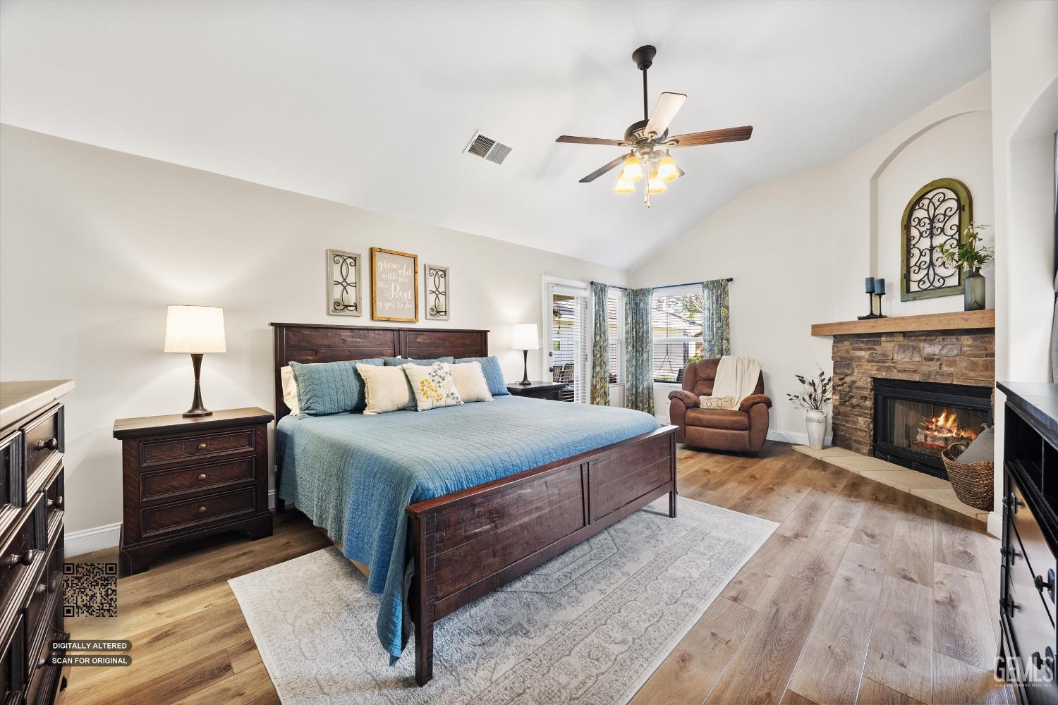 Undisclosed Address Bakersfield, CA 93314 - Photo 25 of 58 a bedroom with a bed and a fireplace