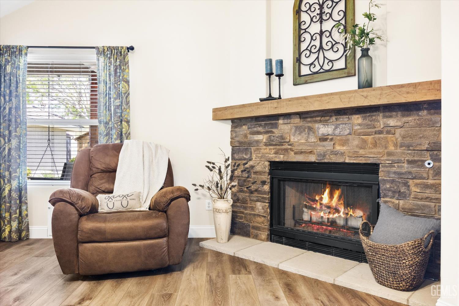 Undisclosed Address Bakersfield, CA 93314 - Photo 27 of 58 a living room with furniture and a fireplace
