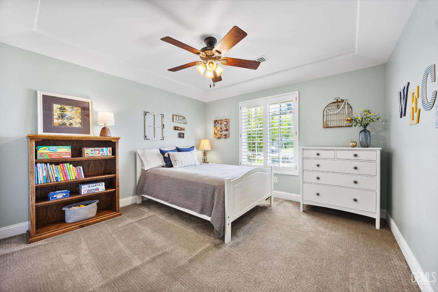 Undisclosed Address Bakersfield, CA 93314 - Photo 31 of 58 a bedroom with a bed and a window