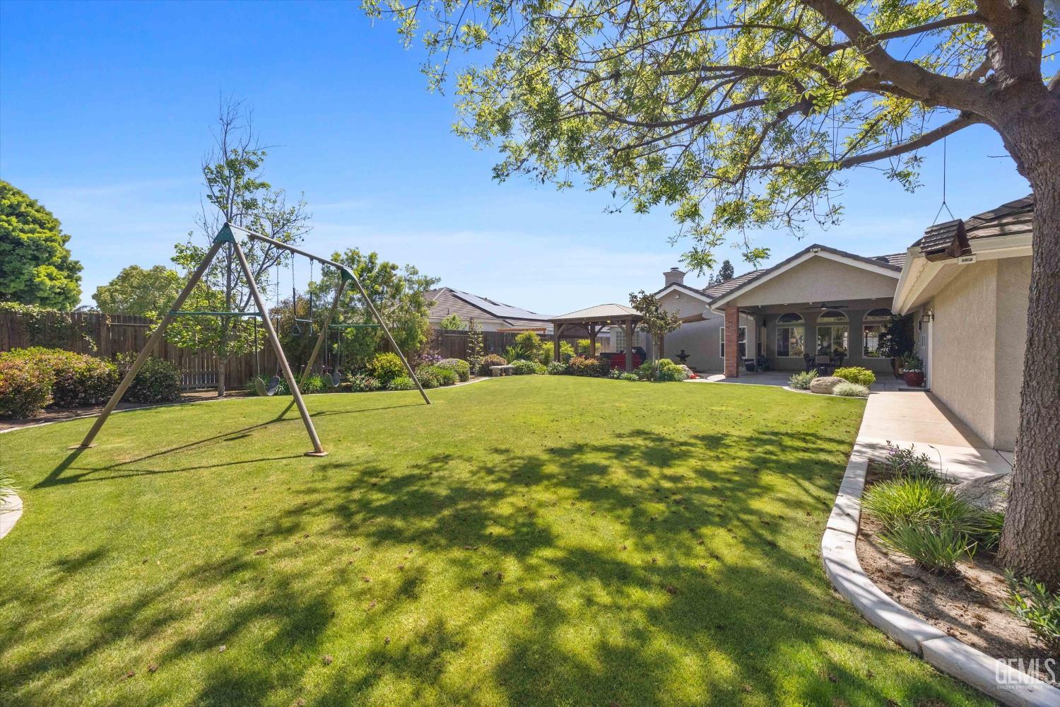 Undisclosed Address Bakersfield, CA 93314 - Photo 49 of 58 a view of a house with a yard