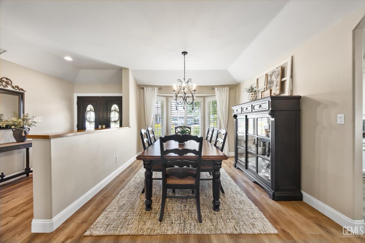 Undisclosed Address Bakersfield, CA 93314 - Photo 8 of 58 a dining room with furniture window and wooden floor