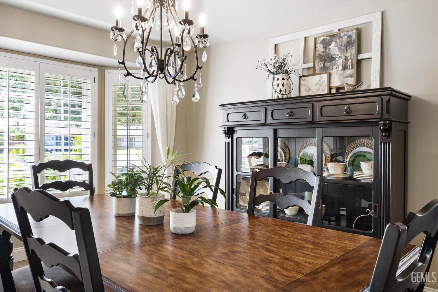Undisclosed Address Bakersfield, CA 93314 - Photo 9 of 58 a view of a dining room with furniture and chandelier