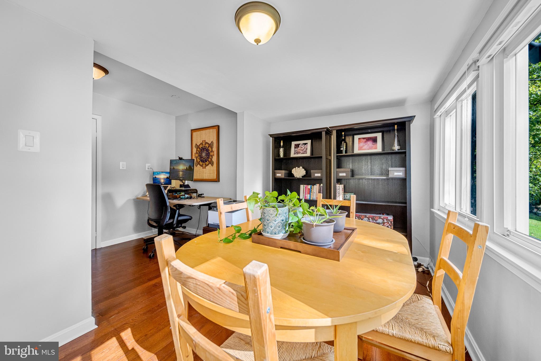 12312 Valleywood Drive Silver Spring, MD 20902 - Photo 20 of 65 a dining room with furniture and a window