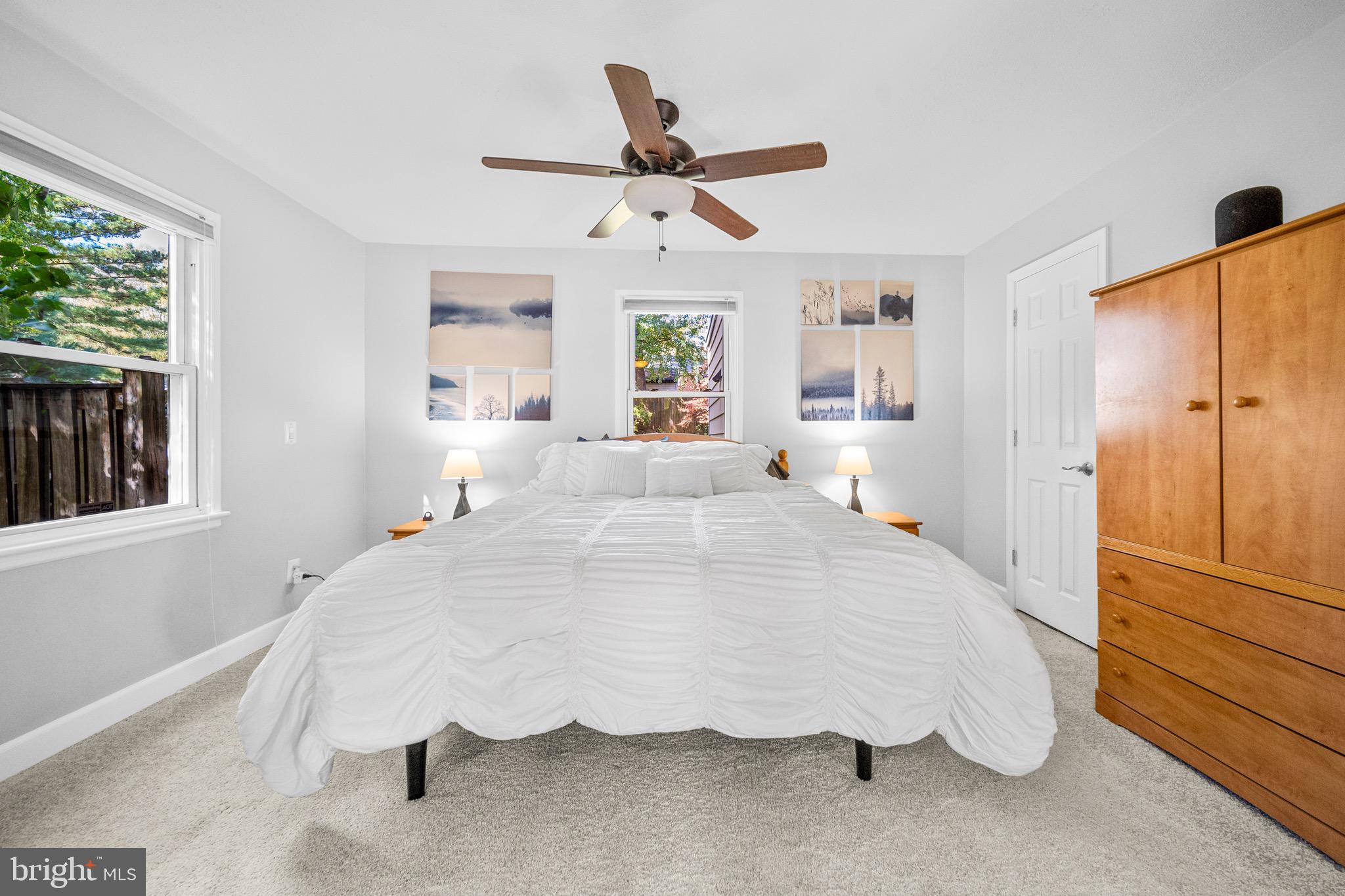 12312 Valleywood Drive Silver Spring, MD 20902 - Photo 24 of 65 a spacious bedroom with a bed and window