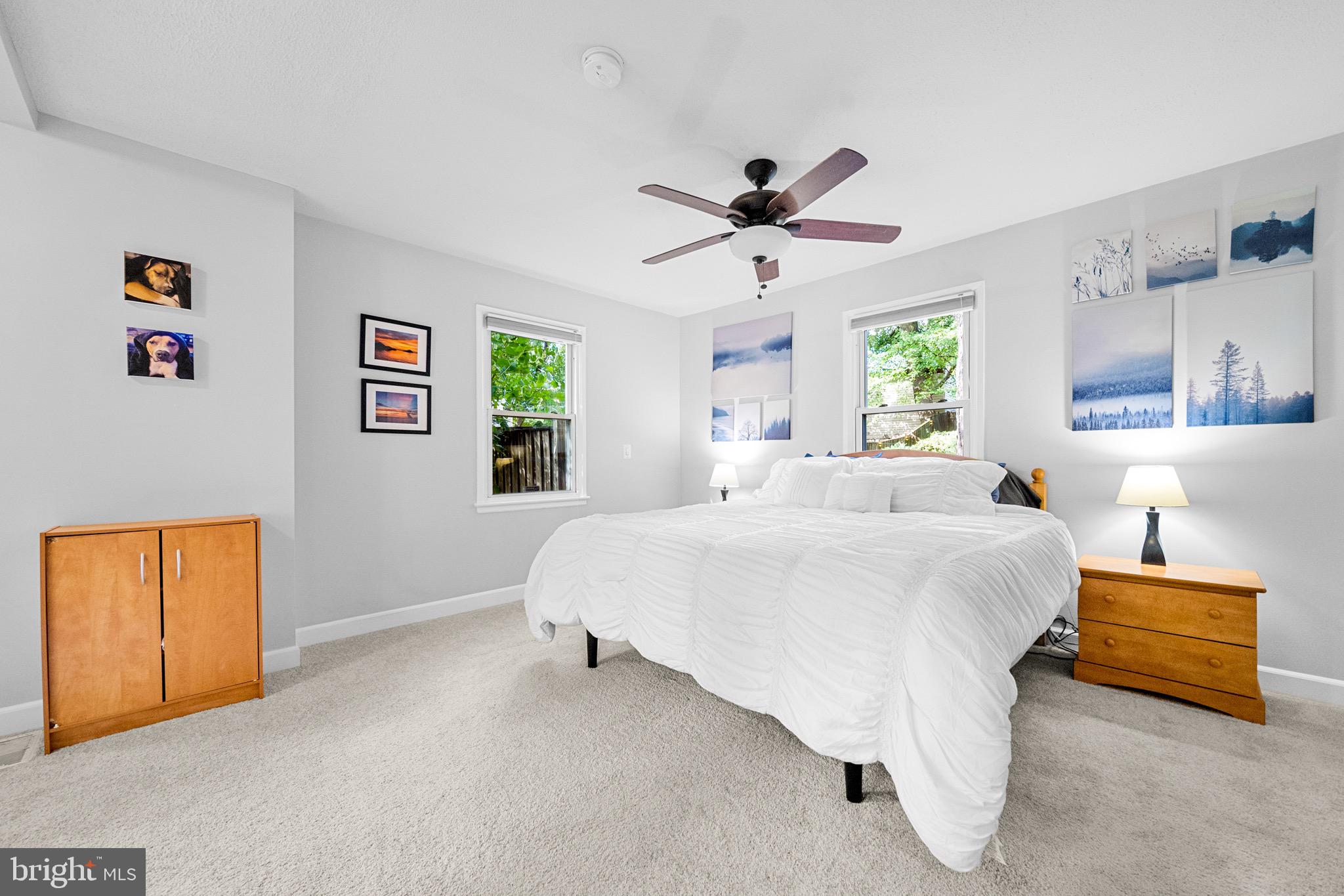 12312 Valleywood Drive Silver Spring, MD 20902 - Photo 28 of 65 a bedroom with a bed and a chandelier