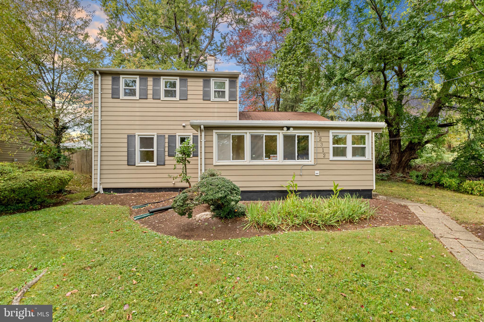 12312 Valleywood Drive Silver Spring, MD 20902 - Photo 3 of 65 a front view of a house with garden