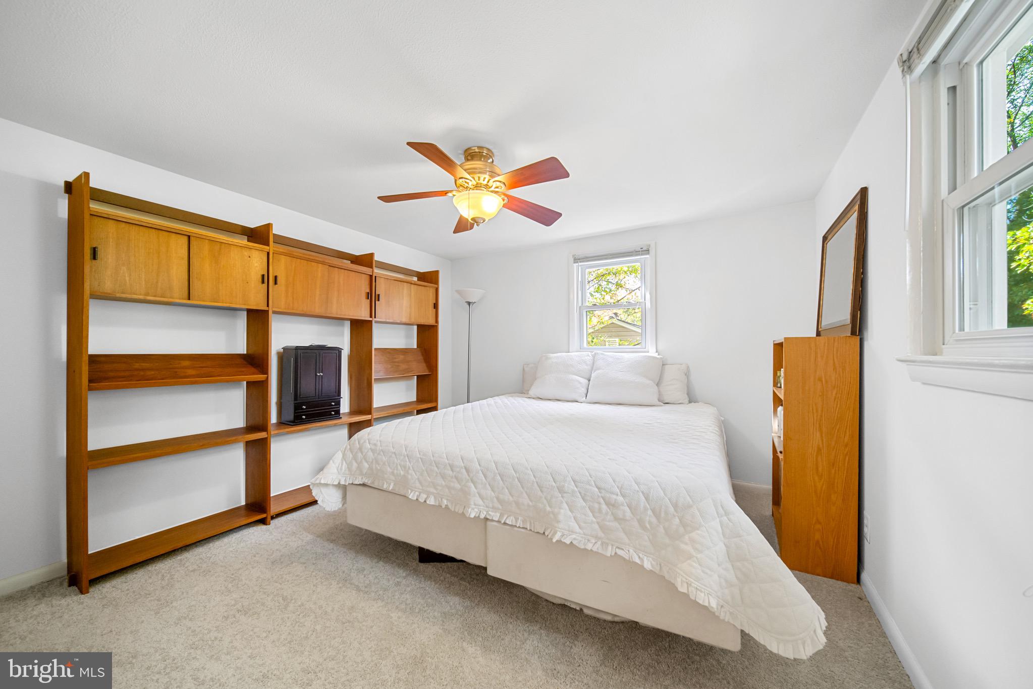12312 Valleywood Drive Silver Spring, MD 20902 - Photo 32 of 65 a bedroom with a bed and a painting on the wall