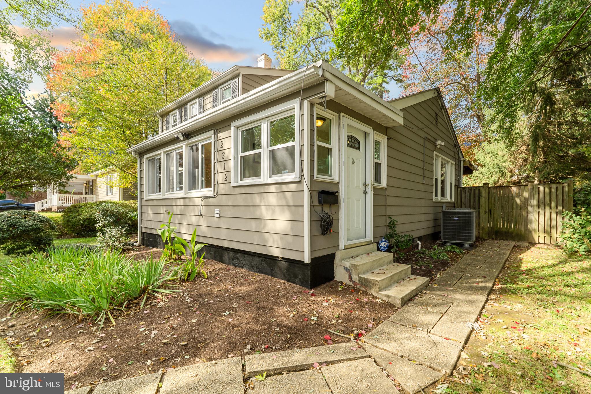 12312 Valleywood Drive Silver Spring, MD 20902 - Photo 43 of 65 a front view of a house with a yard