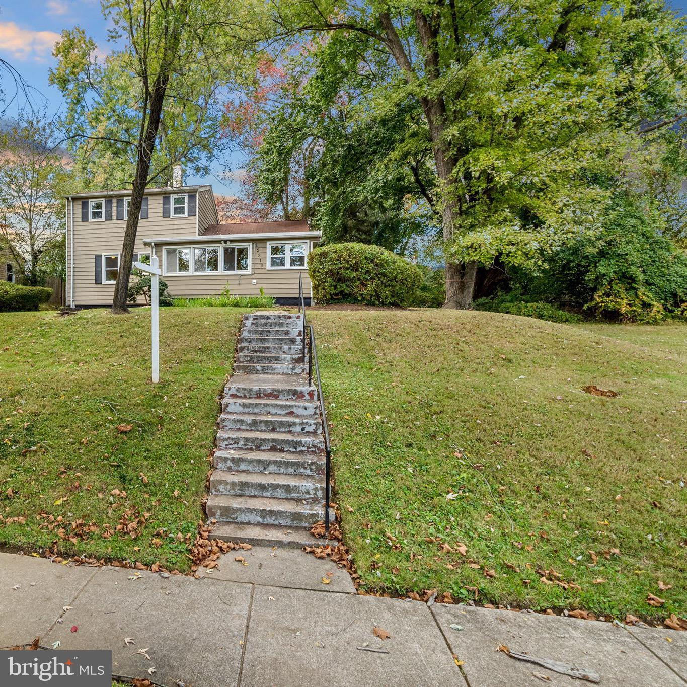 12312 Valleywood Drive Silver Spring, MD 20902 - Photo 45 of 65 a front view of a house with a yard