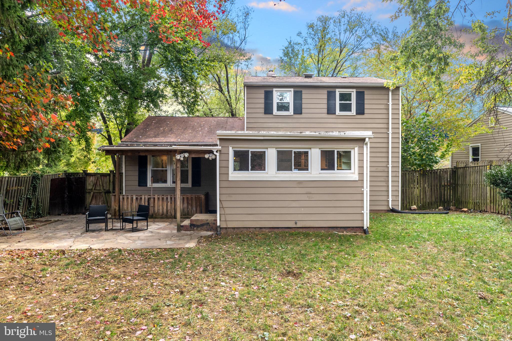 12312 Valleywood Drive Silver Spring, MD 20902 - Photo 53 of 65 a backyard of a house with yard and seating area