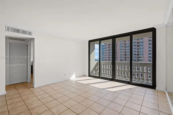 a view of an empty room and window