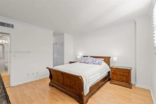 a view of a hallway with wooden staircase