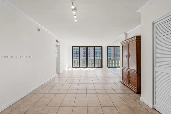 a view of an empty room with a window