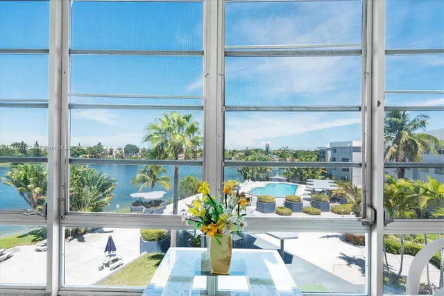 a view of a glass door with a chairs