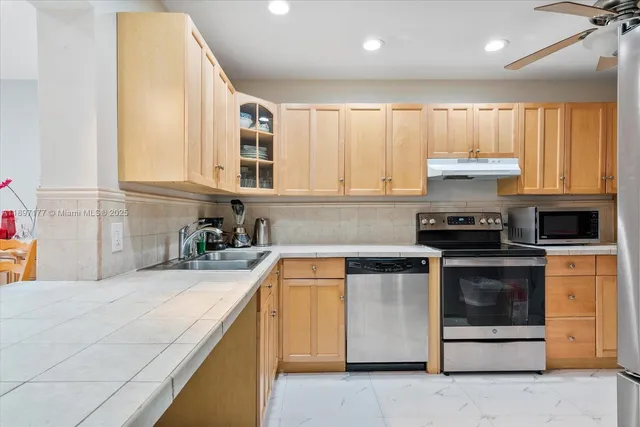 a kitchen with a stove and a sink