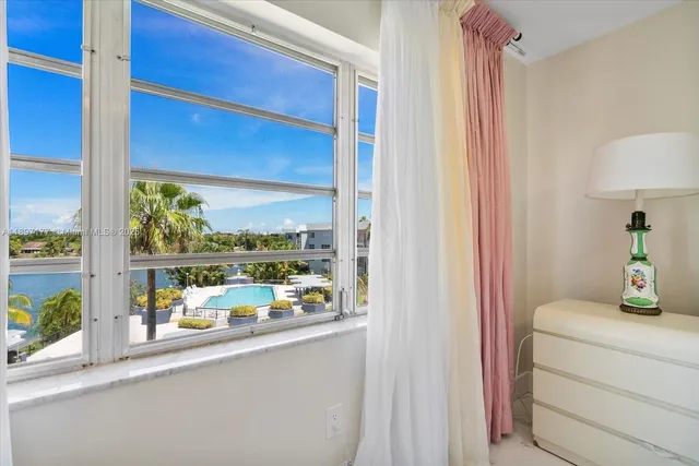 a room with a table and a potted plant