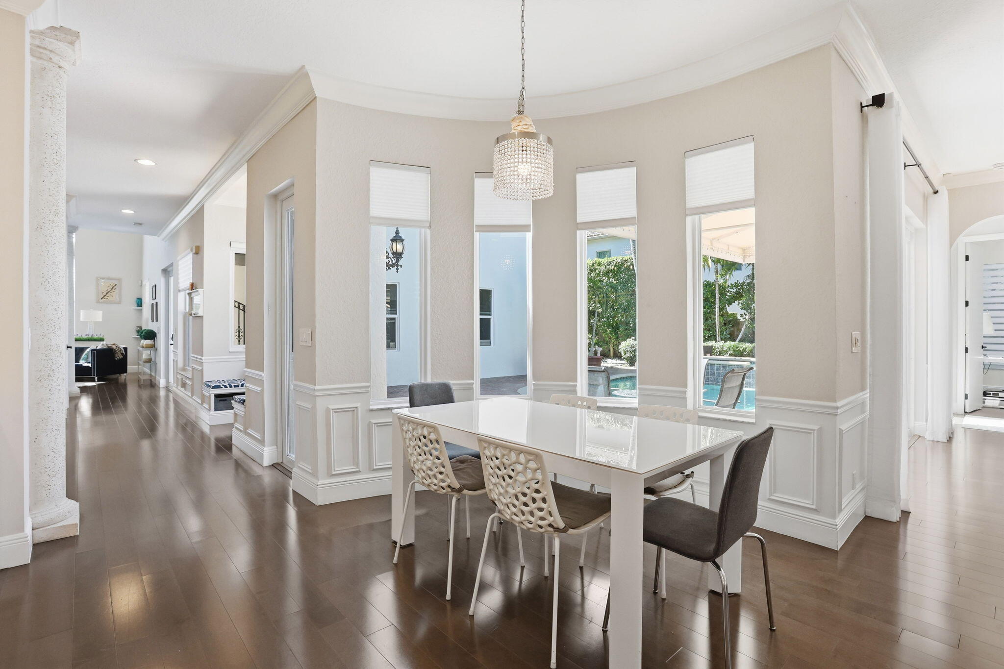 375 Southwest 16th Street Boca Raton, FL 33432 - Photo 14 of 42 a view of a dining room and livingroom with furniture wooden floor a chandelier