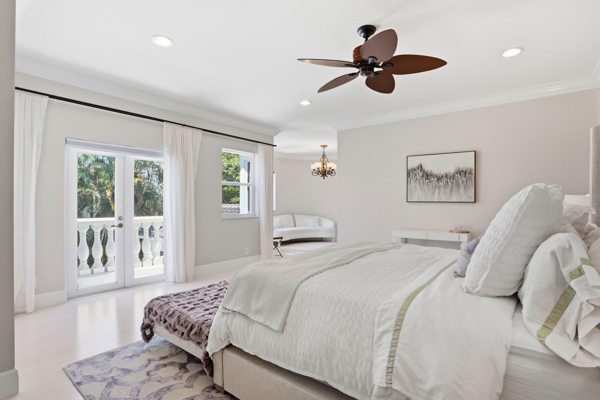 375 Southwest 16th Street Boca Raton, FL 33432 - Photo 18 of 42 a bedroom with a bed and a chandelier